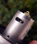 Close-up of Top Tier Rs 545 High Power Electric Fan Motor Featuring A Reliable Ball Bearing Design, highlighting connections.