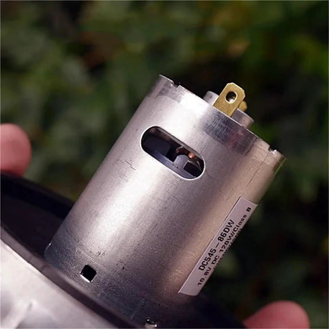 Close-up of Top Tier Rs 545 High Power Electric Fan Motor Featuring A Reliable Ball Bearing Design, highlighting connections.