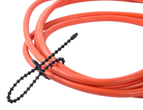Beaded Cable Tie Wrap 12 Inch Bead Tie System For Wire And Cord Management 70 Lb Reusable Adjustable Black on orange cord