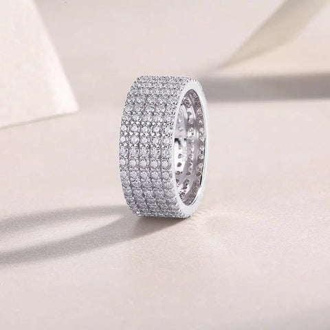 Fresh Drip Platinum Plated Moissanite Grid Engagement Ring Featuring A Smooth Wide Band And Lab Grown Diamond Sparkle Set In Solid Certified 925 Sterling Silver Ring For Her displayed on a light background.