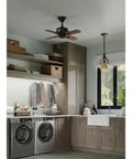 Kitchen with One Light Bell Shaped Mini Pendant With Tea Colored Shade In Forged Bronze Finish From Torino Collection over sink