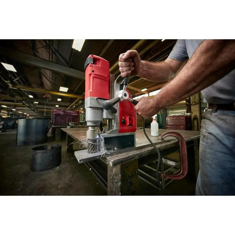 Get The New 4272-21 Electromagnetic Drill Kit With Carrying Case For Milwaukee Tools in use drilling metal with precision.