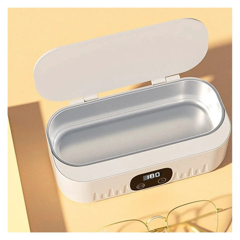 Knockout Portable Ultrasonic Cleaner For Glasses And Jewelry Using High Frequency Vibration And Eco Friendly Deep Wash Tech To Make Your Treasures Look Slick And Sparkling Fresh In Pink, showing open lid and inner basin.
