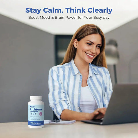 Woman using laptop with Lithium Orotate 5mg 13 In 1 Daily Balance Supplement bottle visible on the table.