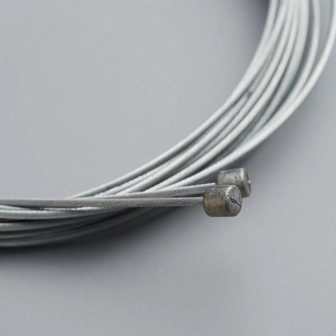 Close-up of shifter cables in Universal Bicycle Shifter Cable Housing Set For Derailleur Systems Durable Black Upgrade Kit.
