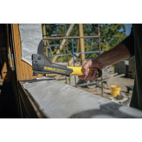 Lightweight Carbon Fiber Stapler With Drop In Loading Auto Lock Anti Jam Pinch Latch in use on construction site