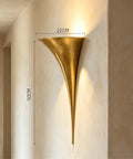 Curved Flared Metal Wall Sconce With Vintage Brushed Copper Iron Design Adds A Killer Upward Glow Perfect For Super Cozy Bedroom Reading And Chic Home Decor side view mounted on wall