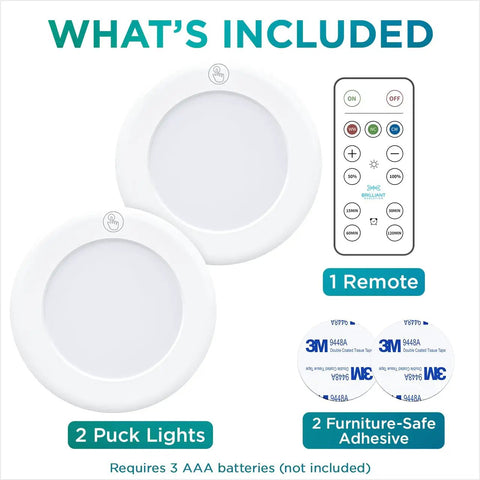 Contents of Stick On LED Puck Lights With Remote, Battery Powered Wireless Cabinet Lighting, 2 Pack, adhesive and remote shown