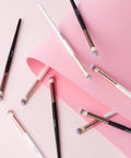 20 Pack Lash Bath Pro Grade Cleaning Brushes For Lash Extensions And Natural Lashes on pink background, white and black brushes visible.