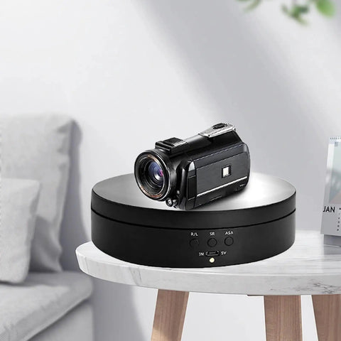 Premium Electric Rotating Display Turntable With Remote Control Brings Your Jewelry Cosmetics Watches And Ornaments To Life During 360 Photo Shoots Using Handy 5V USB Power Or Battery For Smooth Adjustable Speed Shows with camera on top.
