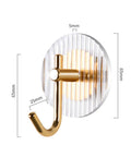 Kick Clutter To The Curb With This Slick Space Saving Wall Hook designed for entryway, made of striped acrylic and gold metal.
