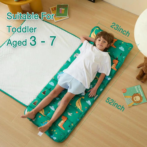 Child lying on Rollup Toddler Nap Mat With Removable Pillow And Minky Blanket Dinosaur Themed Sleeping Bag For Daycare Preschool Travel And Camping Soft Fleece Comfort For Kids, 52x23 inches