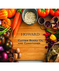 Heavy-Duty Go-To Butcher Block Conditioner And Cutting Board Oil, 12 Oz, surrounded by colorful vegetables on a wooden board.