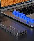 Built Tough 40Gbps M.2 NVMe SSD Enclosure With Sleek Aluminum Build And Internal Turbo Cooling Fan connected to a laptop.