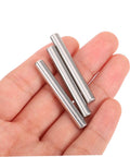 Three 304 Stainless Steel Dowel Pins in hand, part of 100 pieces cylindrical fastening elements for shelf support, automotive and machinery applications.