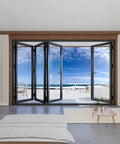 Premium Aluminum Bifold Door 120X96 Black With Four Low E Tempered Glass Panels open to a bright outdoor patio view.