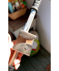 Close-up of Ropematic Pro Manual Rope Puller for Fish Tape and Mule Tape Pulling, ergonomic handle, metal components visible.