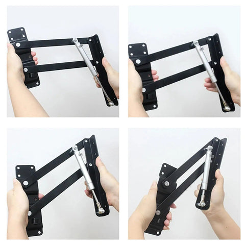 Hands holding Two Piece Black Folding Spring Table Hinge For Lift Up Tables And Laptop Coffee Tables Heavy Duty Metal Hinge Hardware