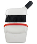 Compact Dustpan And Brush Set With Snap In Design And Bristle Cover, Soft Rubber Lip for seamless cleaning on any surface displayed.