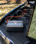 Dope 400 Watt Car Power Inverter Plugs Straight Into Socket To Transform 12 Volts Into 110 Volts AC on car hood.