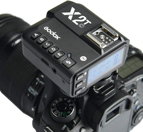 Canon TTL Wireless Flash Trigger With Bluetooth App Control attached to camera showing top control buttons and screen