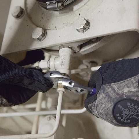 Gloved hands using a 6 Inch Adjustable Wrench With Slimmer 40 Percent Jaws And A High Polish Chrome Finish on tight gas line