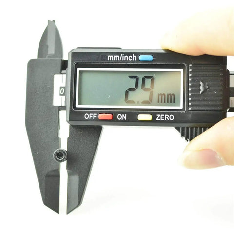 Digital caliper measuring the 9mm length of a Heavy Duty M3x9mm Hex Socket Head Cap Screw, Grade 12.9 Alloy Steel, Black Oxide Finish.