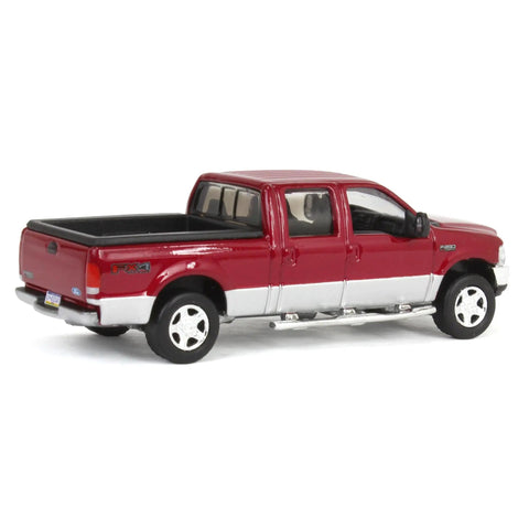 Ford F 250 Super Duty Crew Cab Diecast Pickup Truck Red And Silver One Sixty Fourth Scale Model With Dope Metal Chassis And Real Rubber Tires Collectible Display Piece viewed from rear side angle