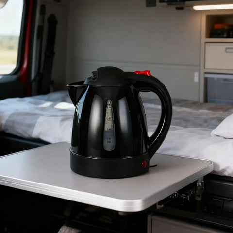RigReady 24V 250W Portable Electric Kettle For Trucks And Rv placed on a tabletop in a truck interior for convenient access.