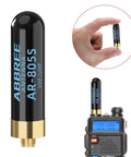 Dual Band Ham Radio Antenna For VHF UHF 144 430 MHz, 1.96 Inch Stubby SMA Female Long Range Antenna shown with radio and in hand.