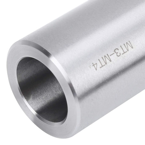 MT3-MT4 taper drill sleeve adapter, silver steel, through bore — close-up side view.