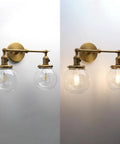 Vintage Industrial Wall Sconce With Switch 180 Degree Adjustable Hardwired Vanity Light With 5.9 Inch Globe Glass Shade In Antique Gold Two Light for Bathroom Living Room Kitchen, illuminated view.