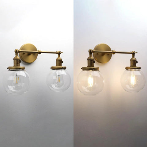 Vintage Industrial Wall Sconce With Switch 180 Degree Adjustable Hardwired Vanity Light With 5.9 Inch Globe Glass Shade In Antique Gold Two Light for Bathroom Living Room Kitchen, illuminated view.