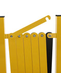 Close-up of Heavy Duty Yellow And Black Folding Security Gate Built Like A Tank With Top Shelf Craftsmanship showing hinge detail.