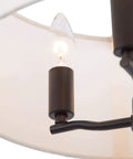 Close-up of Totally Chic Modern Farmhouse Drum Chandelier's candle-style bulb and linen fabric shade, 16 inch diameter.