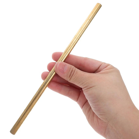 Person holding a polished rod from 4 Piece Solid Brass Rod Kit For DIY Makers And Craft Projects Polished Round Brass Bars 0.16 Inch 0.20 Inch 0.24 Inch 0.31 Inch Diameters And 7.8 Inch Length Versatile For Jewelry Making Woodworking Design Tools And Prototyping