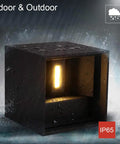 6000K LED Cube Wall Light 4.7 Inch Exterior Die Cast Aluminum IP65 Waterproof Slick Sconce shown with light on in rain