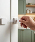 Hand using key on adhesive kid proof child safe cabinet locks with key for cabinets drawers and doors multi purpose latches