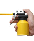 Side view of HUAXIU 8oz yellow metal oil can oiler with black trigger and long spout held in hand