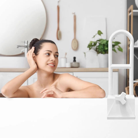 Bathtub Safety Rail With Adjustable Clamp And Grasp Handle for Easy Entry And Exit Heavy Duty Stainless Steel With No Slip Grip shown by a bathtub