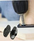 Installation of Dead Simple Sectional Sofa Connectors Pin Style Furniture Buckles with a drill on a wooden frame.