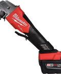Kickass Brushless Cordless Two Piece Power Duo Combining 18 Volt Four Point Five Inch Grinder With Three Eighth Impact Wrench Paired With Two Tough Five Amp Batteries Made For Quick Fixes And All Day Job Site Grinds - Milwaukee M18 Fuel impact wrench with REDLITHIUM XC 5.0 battery.
