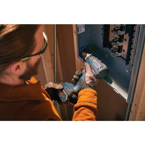 Man using 18V Brushless Hammer Drill Driver With Optional Bluetooth Connectivity Module Compact Half Inch Cordless Drill Kickback Control 20 Plus 1 Clutch EC Motor Bare Tool For Tough Jobs to drill into metal panel