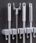 Wall Mounted Broom And Mop Organizer With Four Racks And Five Hooks For Home Kitchen Garage Garden Laundry Room And Bathroom Storage Keeps Cleaning Tools Neatly Stored And Easily Accessible against wall