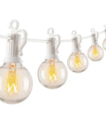Outdoor String Lights 25 Feet G40 Globe Bulbs With 27 Edison Glass Bulbs Plus 2 Spares, shown illuminated in a row.