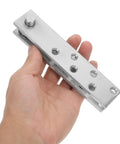 Heavy Duty Stainless Steel Concealed Door Hinge for Bookcase Doors shown on hand, highlighting smooth pivot design for sleek performance