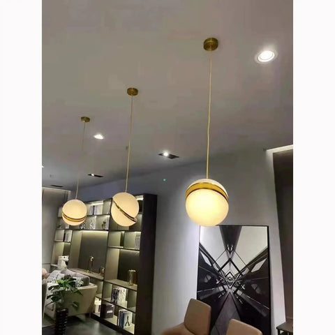 Dope Irregular White Acrylic Globe Pendant Lamp For Dining Room And Living Room Eleven Point Eight Inch Globe Look Adjustable Fifty Nine Inch Cable 110 To 140 Volt UL Certified Modern Hanging Light Fixture, three lamps shown in a modern living room setting.