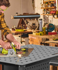 Man using power tool on 36 By 24 Inch Welding Table With Wheels Mobile Steel Workstation Heavy Duty Design for sawing and fabrication