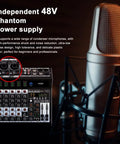 Six Channel Pro Audio Mixer With 99 DSP Effects Phantom Power 48V Bluetooth USB Interface Two Aux Sends FX Processor, viewed beside a studio microphone.