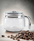 50s Retro Style Glass Coffee Carafe Replacement For DCF02 Overflow Coffee Maker with chrome handle, beside coffee beans.